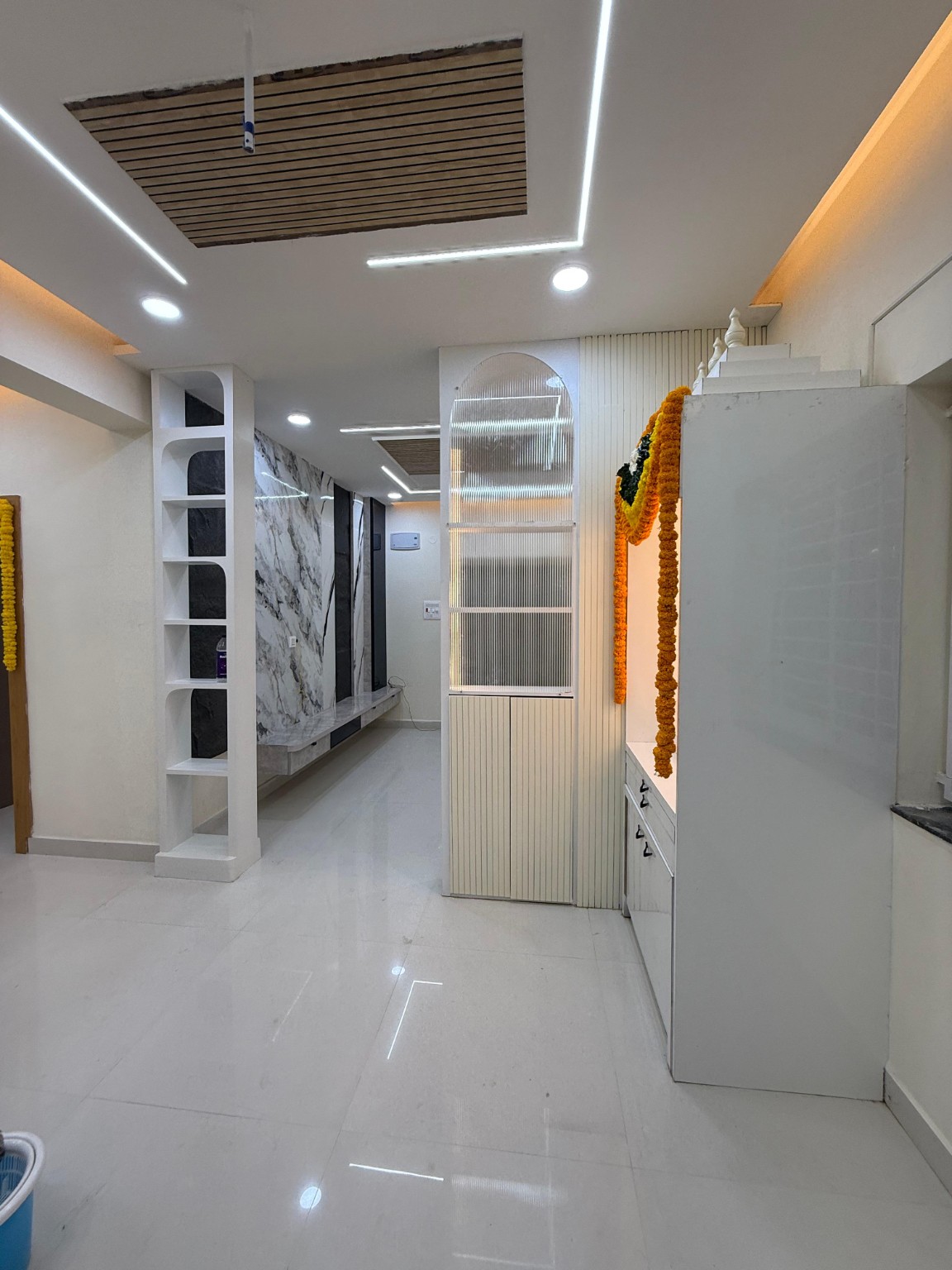 Contemporary hallway with marble feature wall