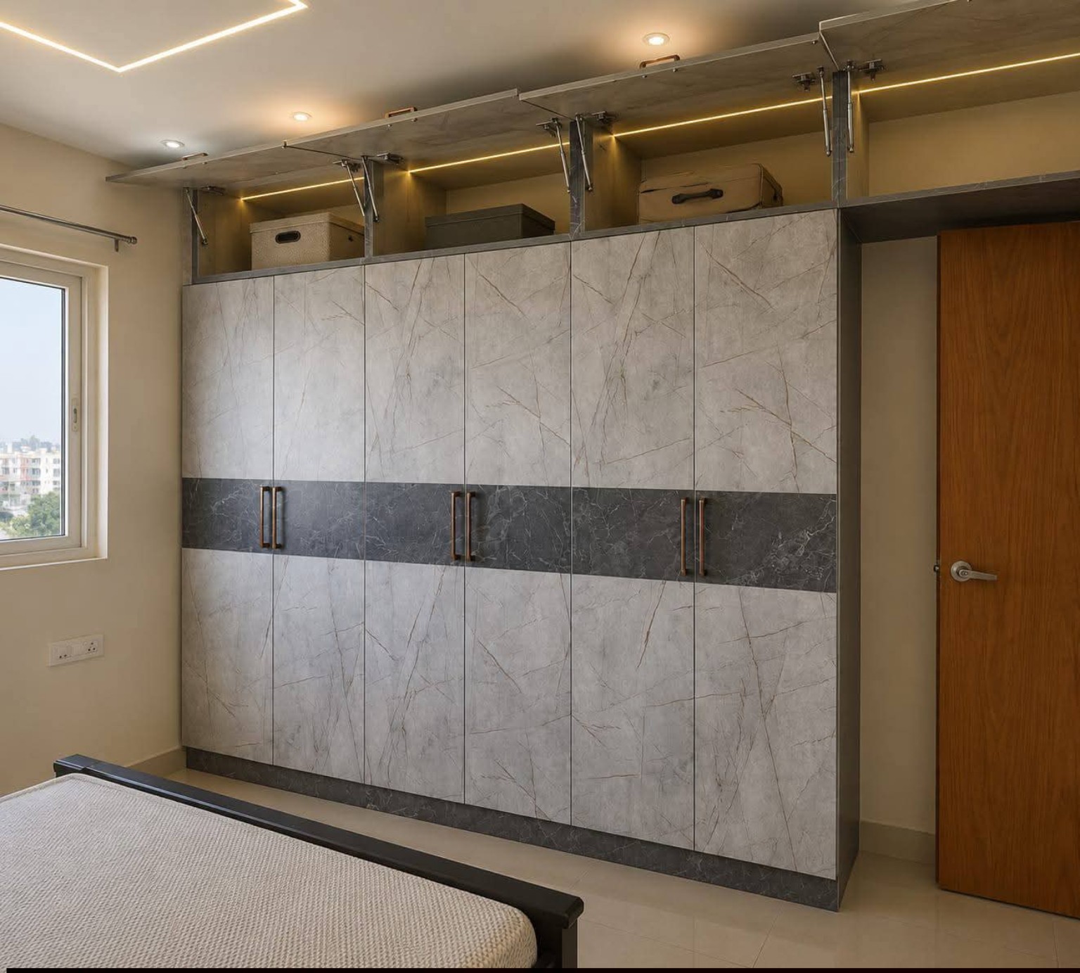 Contemporary marble-finish wardrobe with warm lighting